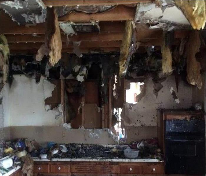 fire damaged kitchen with soot damage