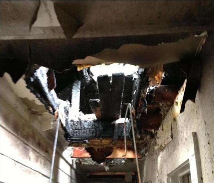 fire caused hole in ceiling