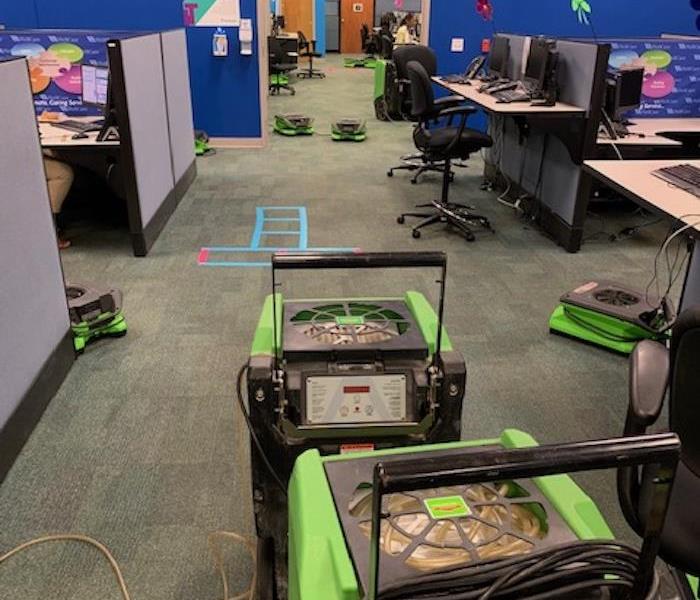SERVPRO drying equipment brought in to dry the carpet in a customer service center