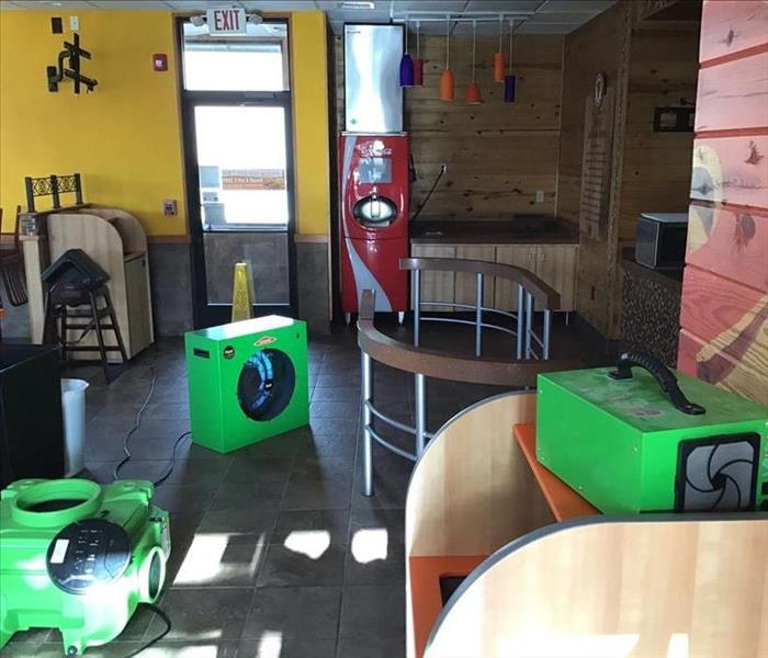 SERVPRO drying and purifying equipment in a store