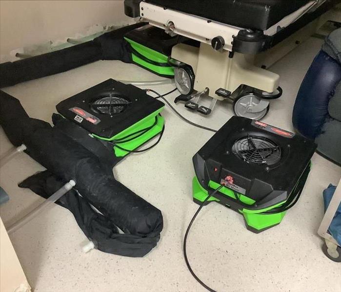 SERVPRO air movers placed around affected wet areas on floor