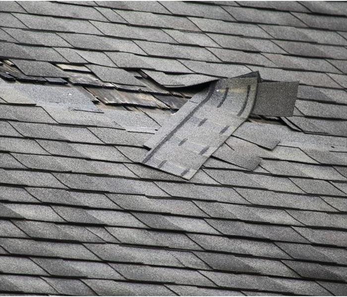 Damaged roof; shingles removed